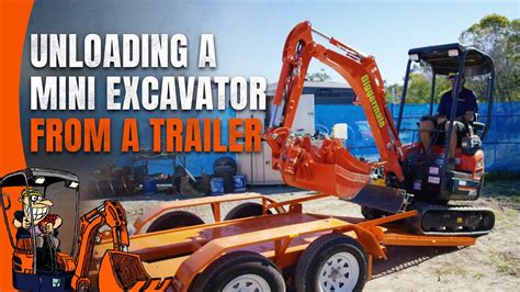 loading a mini excavator|unloading mini excavator on trailer.